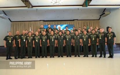 <p><strong>PROMOTED.</strong> Philippine Army (PA) commander, Lt. Gen. Gilbert Gapay poses with 39 newly-promoted generals in Fort Bonifacio, Taguig City on Wednesday (Dec. 11, 2019). These officers occupy the highest command positions among Company and Field Grade Officers. <em>(Photo courtesy of Army Chief Public Affairs Office)</em></p>
