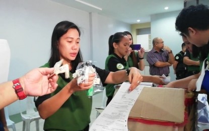<p><strong>DRUG DESTRUCTION.</strong> Personnel of the Philippine Drug Enforcement Agency in Region 6 conduct an inventory of drugs surrendered from court and pharmaceutical companies on Thursday (Dec. 12, 2019) at Gegato Abecia Crematory in Jaro, Iloilo City. The burned seized dangerous drugs and expired medicines worth around PHP8.8 million. <em>(PNA photo by Gail Momblan)</em></p>