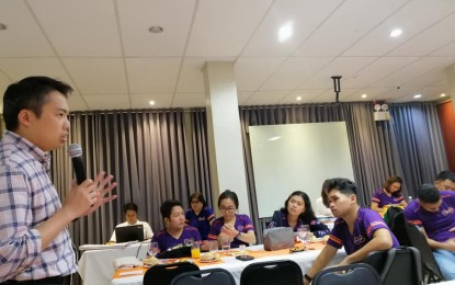 <p><strong>COMMUNICATION PLAN</strong>. Jay Joel Soriano, (left) who heads the Integrated Planning Group of Energy Development Corporation (EDC), speaks to BINHI Youth Leaders on "surviving the real world" on Wednesday (Dec. 11, 2019). Forty BINHI youth leaders from Negros Oriental and Negros Oriental attended a two-day BINHI camp where they were asked to present their environmental advocacy communication plan. <em>(Photo by Judy Flores Partlow)</em></p>