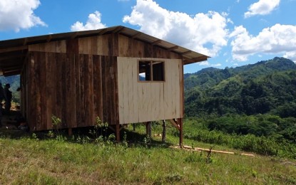 <p><strong>TRIBAL HALL.</strong> The tribal hall of the Higaonon Indigenous People nears completion as of Wednesday (Dec. 11, 2019) as it stands overlooking the Higaonon community in the hinterland barangay of Pigsag-an, Cagayan de Oro City. The Philippine Air Force's Technical Operations Group-10 led the construction of the hall as a way of making government services more accessible to tribal communities in the area. <em>(PNA photo by Nef Luczon)</em></p>