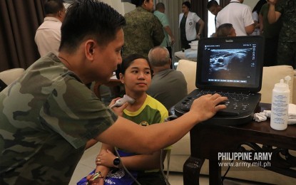 <p><strong>FREE MEDICAL SERVICES.</strong> Army personnel avail of free medical services provided by the Office of the Army Chief Surgeon in Fort Bonifacio, Taguig City on Thursday (Dec. 12, 2019). Among the free medical services offered during the activity were hypertension screening, diabetes screening, vaccination, pharmacy counseling, nutrition counseling, vision screening with eyeglass fitting, physical therapy, thyroid ultrasound, wart removal, consultation and anti-rabies vaccines for canine and felines, OB-Gyn consultation, pediatric consultations, mental illness, and burnout screening.<em> (Photo courtesy of the Army Chief Public Affairs Office)</em></p>