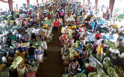 <p><strong>HIGHLAND VEGETABLES</strong>. The vegetable trading post in La Trinidad where trading, packing and selling of the highly perishable items take place before they are brought to the major markets. The produce will be transported as far as Palawan and General Santos City in the south. <em>(PNA file photo by Liza T. Agoot)</em></p>
