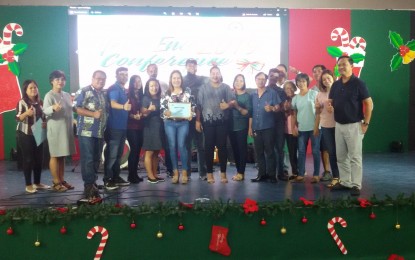 <p><strong>ENVIRONMENTAL AWARDEES</strong>. Leaders of 20 villages in Legazpi City receive recognition in the annual Solid Waste Management Awards initiated by the City Environment and Natural Resources Office (CENRO) on Sunday (Dec. 15, 2019). Legazpi City is the only local government unit in Bicol region, which has an engineered sanitary landfill fully compliant with Republic Act 9003, the Ecological Solid Waste Management Act of 2000. <em>(Photo by Emmanuel Solis)</em></p>