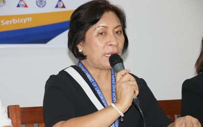 <p><strong>WORKERS’ WELFARE.</strong> Department of Labor and Employment (DOLE-13) Regional Director Chona Mantilla reports the regularization of 3,268 workers in private companies in Caraga Region in 2019 during a press briefing held in Butuan City on Monday (Dec. 16, 2019). Mantilla also reported of 79.83 percent compliance rate this year on minimum wage among the establishments in Caraga Region, which is higher than the 76 percent compliance recorded last year. <em>(PNA photo by Alexander Lopez)</em></p>