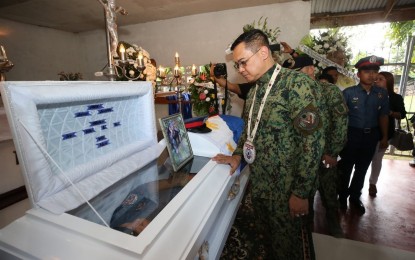 <p><strong>LAST RESPECTS</strong>. Philippine National Police officer-in-charge, Lt. Gen. Archie Francisco Gamboa pays his last respects to Pat. Mark Jerome Rama who was killed during a landmine attack staged by the CPP-NPA last Dec. 13, 2019 in Borongan, Eastern Samar. The PNP is set file cases against the NPA members who were behind the attack. <em>(Photo courtesy of PNP)</em></p>