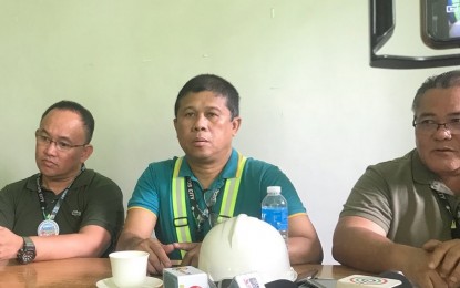 <p><span lang="EN-US"><strong>NO MAJOR DAMAGE.</strong> Engr. Emerald Signar (center), assistant head of the City Engineer’s Office, on Monday (Dec. 16, 2019) says no major damages were recorded in government and private buildings and other vital structures in General Santos City in the wake of the magnitude 6.9 earthquake that hit parts of Mindanao on Sunday afternoon. Also in photo are City Disaster Risk Reduction and Management Office head Agripino Dacera Jr.(right) and City Administrator Arnel Zapatos (left). <em>(PNA photo by Richelyn Gubalani)</em></span></p>