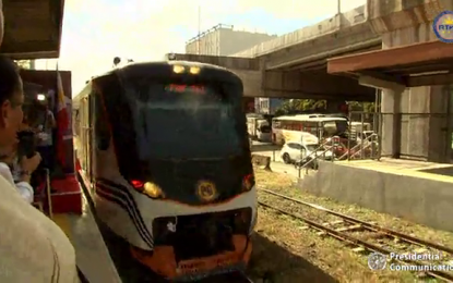<p><strong>8000-CLASS TRAINS.</strong> One of Philippine National Railways' (PNR) two new train sets, made up of six Diesel Multiple Unit railcars from Indonesia, arrives at the PNR Dela Rosa Station for its inaugural run on Monday (Dec. 16, 2019). PNR General Manager Junn Magno said the inaugural run was part of rail tradition to christen the first-type of train launched in a new class. <em>(Screengrab from RTVM)</em></p>