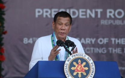 <p><strong>CRUSH ILLEGAL DRUGS, TERRORISM.</strong> President Rodrigo Roa Duterte graces the 84th anniversary of the Armed Forces of the Philippines (AFP) at the Lapu-Lapu Grandstand in Camp Emilio Aguinaldo, Quezon City on Tuesday (December 17, 2019).  Duterte renewed his call to the AFP to crush illegal drugs and terrorism to ensure a safer country for the future generations of Filipinos. <em>(PNA photo by Joey O. Razon)</em></p>