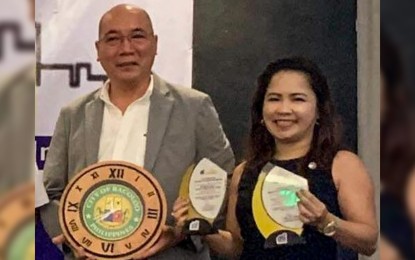 <p><strong>AWARDS.</strong> Vice Mayor El Cid Familiaran (right) and Local Economic and Investment Promotions Officer-designate Jonah Javier with the trophies received by the City of Bacolod as the Most Competitive Highly Urbanized City in Western Visayas in the pillars of Economic Dynamism and Infrastructure. The awards were given during the 3rd Recognition Ceremony for Competitive Local Government Units held at Hotel del Rio in Iloilo City on Monday (Dec. 16, 2019). <em>(Photo courtesy of Bacolod City PIO)</em></p>