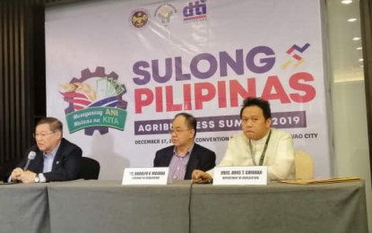 <p><strong>AGRICULTURE BUDGET.</strong> Finance Secretary Carlos Dominguez (extreme left) explains the possible sources of funding for the Agriculture budget in 2020 during the Sulong Pilipinas Agribusiness Forum in Davao City on Tuesday (December 17, 2019). Dominguez assures that the Department of Agriculture's PHP150-billion allocation will be granted either through tax increase or loans.<em> (PNA photo by Che Palicte)</em></p>