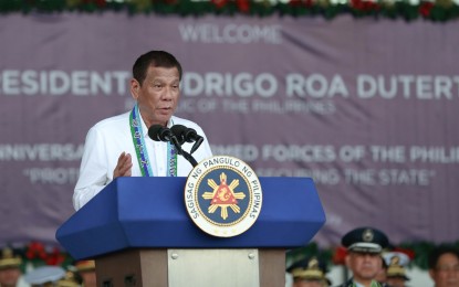 <p><strong>CHANGE OF COMMAND</strong>. President Rodrigo Duterte gives his marching orders to government troops on Saturday (Jan. 4) during the change of command and retirement ceremony for outgoing AFP chief of staff Gen. Noel Clement at Camp Aguinaldo in Quezon City. Clement will be replaced by Gen. Felimon Santos. <em>(PNA file photo)  </em></p>