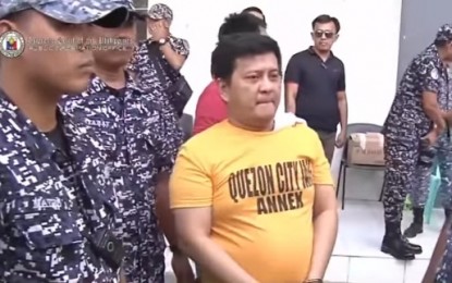 <p><strong>GUILTY.</strong> Personnel from the Bureau of Jail Management and Penology escort Datu Andal Ampatuan Jr., one of the principal accused in the Maguindanao massacre case in Camp Bagong Diwa, Taguig City on Thursday (Dec. 19, 2019). The Quezon City Regional Trial Court found Ampatuan and 20 others guilty of 57 counts of murder and sentenced them to reclusion perpetua (up to 40 years imprisonment) without parole. <em>(Screengrab from PTV)</em></p>