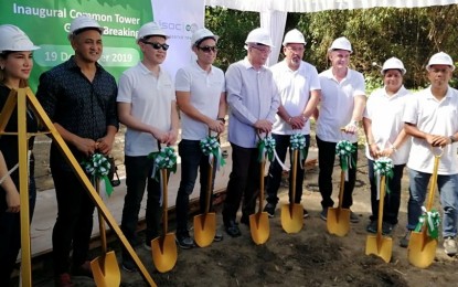 <p><strong>COMMON TOWER</strong>. Department of Information and Communications Technology (DICT) Undersecretary Elizeo Rio (leftmost), with edotco and ISOC infrastructure officials, led the groundbreaking rites for the construction of the first common tower in Addas Greenfield Village, Bacoor City, Cavite on Thursday (Dec. 19, 2019). The infrastructure aims to reduce the country's subscriber-to-tower ratio which currently stands at over 7,000 subscribers per tower. <em>(PNA photo by Gladys S. Pino)</em></p>