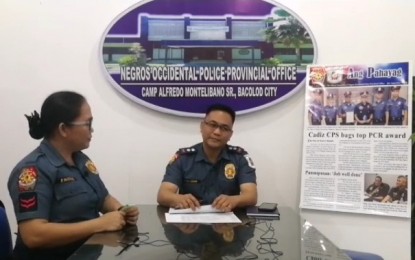 <p><strong>SAFE, SECURED HOLIDAYS.</strong> Lt. Col. Adrian Acollador, deputy provincial director for administration of the Negros Occidental Police Provincial Office, discusses security operations for the Christmas and New Year holidays with Corporal Julie Enrile of the Public Information Office during a Facebook Live interview in Bacolod City on Thursday (Dec. 19, 2019). All units of the provincial police are on a full alert status from December 15 to January 5. <em>(Video grab from NOCPPO Public Information Office)</em></p>