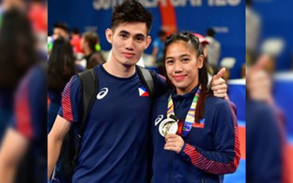 <p><strong>WUSHU GREATS</strong>. Daniel Parantac (left), who won a bronze medal in wushu taolu taijijian pose with Divine Wally after the latter won the gold in the 48 kilograms in wushu sanda at the World Trade Center earlier this month in the 30th Southeast Asian Games. Wally will be one of the recipients of the Athlete of the Year in the Silahis ng Pasko Kislap awards on December 30 for not just winning gold in the SEAG but also a bronze medal in the World Wushu Championships last October in Shanghai, China. Parantac, who will be retiring soon, will also be one of the Kislap awardees along with 36 other athletes. <em>(Photo from the FB of Divine Wally)</em></p>