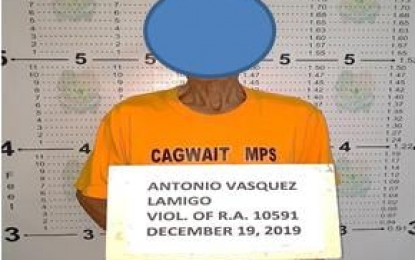 <p><strong>ARRESTED.</strong> Antonio Vasquez Lamigo, 71, is arrested after yielding a firearm and a grenade during a court-ordered search on his house in Cagwait town, Surigao del Sur, on Thursday (December 19, 2019). He is suspected of being a member of the Milisya ng Bayan of the communist New People’s Army. <em>(Photo courtesy of PRO-13 Information Office)</em></p>