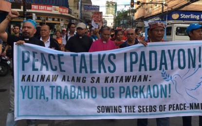<p>Ecumenical religious organizations march to demand the resumption peace talks between the government and the communist rebels and political fronts in Cagayan de Oro City in February 2017. <em>(File photo by Nef Luczon)</em></p>