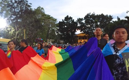 <p><strong>SILENT PRIDE PARADE.</strong> Members of Mindanao Pride carry a rainbow flag, a symbol of the community representing the lesbians, gays, bisexuals, transgenders, queer, intersex, asexual, and others (LGBTQIA+) during the second Pride Parade in Cagayan de Oro City on Sunday (Dec. 22, 2019). The annual parade organized by Mindanao Pride is now in its second year.<em> (Photo courtesy of Mindanao Pride)</em></p>