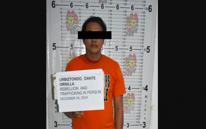 <p><strong>ARRESTED.</strong> Joint operatives of the Philippine National Police and the PHILIPPINE Army arrest Dante Ornilla Urbiztondo, 32, an alleged member of Guerrilla Front Committee 30 of the New People’s Army.. Urbiztondo was arrested on December 24 in Barangay Pag-antayan, Cantilan, Surigao del Sur. <em>(Photo courtesy of PRO-13 Information Office)</em></p>