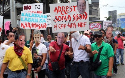 <p><strong>'RETURN JOMA</strong>.' Anti-communist groups, including former members of the New People's Army (NPA), hold a rally condemning the Communist Party of the Philippines (CPP)-New People’s Army (NPA) at the Shrine of Mary, Queen of Peace, Our Lady of EDSA in Quezon City on Thursday (December 26, 2019). These groups demand the return of CPP-NPA-National Democratic Front (NDF) founder Jose Ma. Sison to the Philippines to face charges against him. (P<em>NA photo by Joey O. Razon</em>) </p>