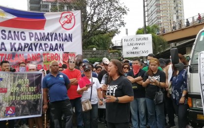 <p><strong>STOP DECEPTION.</strong> Parents call for an end to the alleged deceptive recruitment of minors by left-leaning organizations during a rally on Dec. 26, 2019. The League of Parents in the Philippines has since called out the recruitment of militant groups in schools. <em>(Photo by Lade Kabagani/PNA)</em></p>