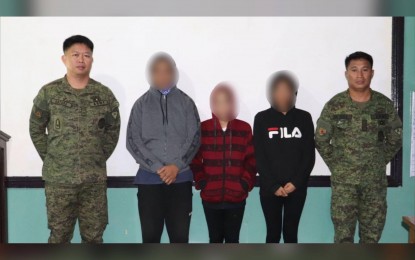 <p><strong>ANNIVERSARY SURRENDER.</strong> Three members of the Communist Party of the Philippines-New People's Army (CPP-NPA) return to the government fold as the rebel group celebrates its 51st anniversary on Thursday (Dec. 26, 2019). The three yielded one .45-caliber pistol and a .38-caliber revolver. <em>(Photo courtesy of 61st Infantry Battalion)</em></p>