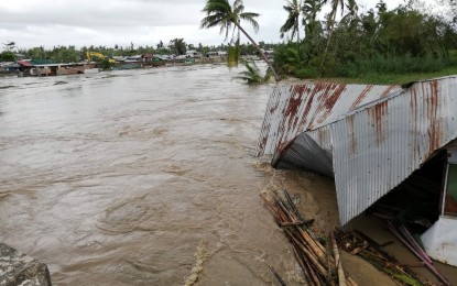 <p><strong>FLOODED.</strong> A flooded community in Palo, Leyte hours after Typhoon Ursula made its landfall. The typhoon killed at least three persons, according to local authorities. <em>(PNA photo by Sarwell Meniano)</em></p>