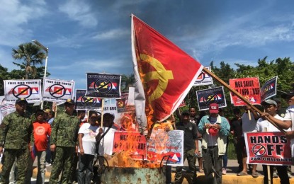 <p><strong>RALLY.</strong> Around 200 residents from various barangays in General Santos City hold an indignation rally against the Communist Party of the Philippines-New People’s Army-National Democratic Front (CPP-NPA-NDF) at the Plaza Heneral Santos on Thursday morning (Dec. 26, 2019). The rally, held during the CPP’s 51st founding anniversary, was joined by officials of the city government, barangay, police, and Army. <em>(PNA photo by Richelyn Gubalani)</em></p>