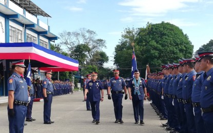 <p><strong>REORGANIZATION.</strong> Lt. Gen. Archie Francisco Gamboa (right), Philippine National Police Officer-in-charge, inspects the men of the Police Regional Office in Western Visayas (PRO 6) at Camp Delgado in Iloilo City on Friday (Dec. 27, 2019). Gamboa bared that regional directors are being evaluated and can be reshuffled during the first month of 2020. <em>(PNA photo by Gail Momblan)</em></p>