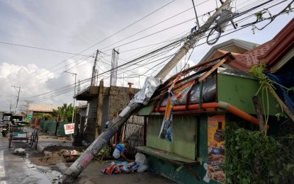 <p><strong>'URSULA'S' IMPACT.</strong> A toppled electric post along a major highway in Tanauan, Leyte. The Leyte provincial government on Thursday (Dec. 26, 2019) placed the entire province under a state of calamity after Typhoon Ursula left a trail of destruction when it crossed the region on Christmas Eve.<em> (PNA photo by Sarwell Meniano)</em></p>