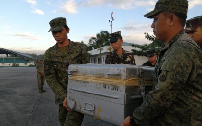 <p><strong>CADAVER SEND-OFF</strong>. The remains of a 29-year-old rebel, identified only as “LJ”, is sent home to his family in Mindanao by government troops Saturday morning. The military exhumed LJ’s remains on Nov. 30 in Nueva Vizcaya after his former comrade bared that his body was buried after dying of pneumonia. <em>(PNA photo by Lade Kabagani)</em></p>
