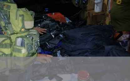 <p><strong>CONFISCATED</strong>. Police and Army personnel confiscated 18 packs of black fatigue pants and 37 packs of poncho tents in a checkpoint in Barangay Sapa, Claver, Surigao del Norte on Saturday evening (Dec. 28, 2019). The items are said to belong to the New People's Army based in Gigaquit town, Surigao del Norte. <em>(Photo courtesy of PRO-13 Information Office)</em></p>