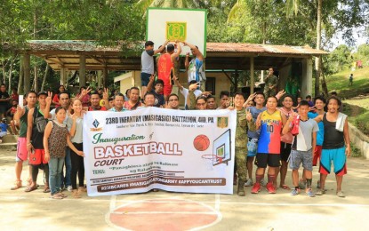 <p><strong>WINNING THE COMMUNITY.</strong> For Army's 23rd Infantry Battalion troopers, winning a basketball game is not only through numbers but also by earning the trust and confidence of community members. The Army battalion, led by Lt. Col. Francisco L. Molin, Jr. conducted a basketball game and the turnover of a basketball court in Sitio Sampinit, Barangay Malapong in Buenavista, Agusan del Norte Tuesday (Dec. 31, 2019).<em> (Photo courtesy 23IB)</em></p>