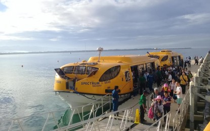 <p><strong>ARRIVALS</strong>. Cruise passengers alight from a boat at the Ilocos port while tour guides welcome them with leis. More cruise lines are expected to visit Ilocos this year with improved ports and other tourism services. <em>(Photo courtesy of DOT Laoag sub-office)</em></p>