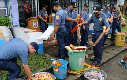 <p><strong>DESTROYED</strong>. Policemen destroy banned firecrackers seized in Tacloban City on Saturday (Jan. 4, 2020). About 84 percent of the illegal firecrackers were confiscated in the city, while the rest were seized in different parts of Leyte. <em>(Photo courtesy of Tacloban City police office)</em></p>