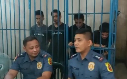 <p><strong>BACK IN JAIL.</strong> Lt. Col. Ariel Pico (right), Bacolod City Police Office (BCPO) public information officer, and Maj. Ruel Culanag, chief of Police Station 3 present the four escapees of BCPO Station 3 during a press conference on Wednesday (Jan. 8, 2020). The four bolted the station’s custodial facility early Monday but surrendered one by one from Tuesday afternoon to Wednesday morning.<em> (Screenshot from BCPO Police Community Relations video)</em></p>
