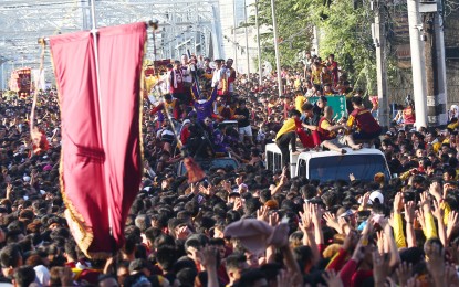 <p><strong>TRASLACION 2020</strong>. A huge number of devotees follow the carriage bearing the image of the Black Nazarene as it crosses the Ayala Bridge on Thursday (Jan. 9, 2020). President Rodrigo Duterte expressed hope that the annual procession of the Black Nazarene would motivate Filipinos to seek "greater progress" in the country. <em>(PNA photo by Avito C. Dalan)</em></p>
