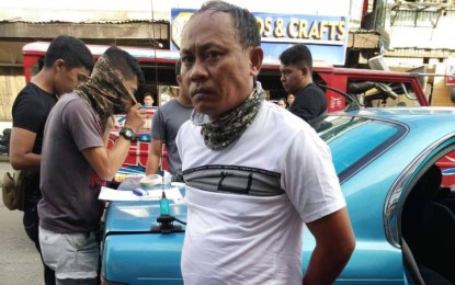 <p><strong>DRUG STING.</strong> Jamil Camid, 44, former barangay councilor of Poblacion East, Baloi, Lanao del Norte, is arrested Wednesday afternoon (January 8) in an anti-drug buy bust by the Iligan City Police Station 5 and the Regional Drug Enforcement Unit, in Barangay Poblacion, Iligan City. The suspect is in the local police's anti-drug watchlist.<em> (Photo courtesy of Iligan City Police Station 5)</em></p>
