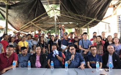 <p><strong>TOTAL DEPLOYMENT BAN.</strong> Labor Secretary Silvestre Bello III (holding the mic) says on Friday (Jan. 10, 2020) the government may declare a total ban on the deployment of overseas Filipino workers to Kuwait in the wake of the questionable autopsy report released by the Kuwaiti government on the death late last month of domestic helper Jeanelyn Villavende. Bello, who held a press conference at the victim’s wake in Barangay Tinago, Norala town in South Cotabato, said the results of the initial autopsy in Kuwait contradicted with the re-autopsy conducted by the National Bureau of Investigation. <em>(PNA photo by Allen V. Estabillo)</em></p>
