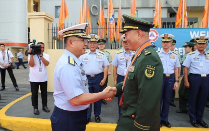 <p><strong>FIRST-EVER MARITIME EXERCISE.</strong> Philippine Coast Guard Commandant, Admiral Joel Garcia (left) formally welcomes China Coast Guard Director General, Major General Wang Zhongcai, and the rest of the CCG contingent in an arrival honors at Pier 15 in Port Area, Manila on Tuesday (Jan. 14, 2020). Garcia said the week-long port call was the "first-ever" formal maritime exercise between the two countries held in the Philippines. <em>(Photo courtesy of PCG)</em></p>