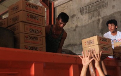 <p><strong>AID TO TAAL VICTIMS</strong>. Volunteers load boxes of food packs on a truck bound for Batangas on Monday (Jan. 13, 2020), to be distributed to the victims of Taal Volcano eruption. Each family pack contains six kilos of rice, six sachets of coffee, four cans of sardines and four cans of corned beef. <em>(Photo courtesy of DSWD-Bicol)</em></p>