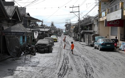 <p><strong>ASH FALL.</strong> This street in Tanauan City, Batangas is covered with ashes from the eruption of Taal Volcano over the weekend. President Rodrigo Duterte will be visiting areas affected by the eruption on Tuesday (Jan. 14, 2020).<em> (PNA photo by Joey Razon)</em></p>