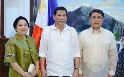 <p><strong>NOT OUT.</strong> President Rodrigo Duterte poses for a photo with Bureau of Customs Commissioner Rey Guerrero following the latter's oath-taking at the Presidential Guest House in Davao City on Oct. 30, 2018. Duterte said he was “satisfied” with Guerrero's performance amid reports that he was going to be replaced. <em>(File photo)</em></p>
