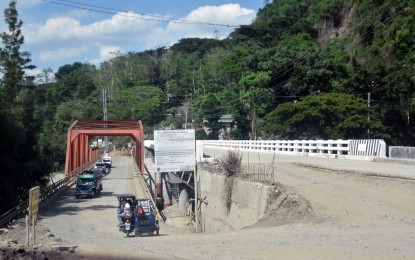 <p><strong>OLD AND NEW.</strong> The Ibulao Bridge that links Lagawe in Ifugao to other towns. It is one of the infrastructure projects expected to be inaugurated in the first quarter of 2020.<em> (PNA file photo)</em></p>