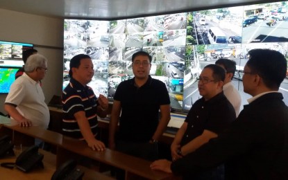 <p><strong>911 COMMAND CENTER.</strong> Department of the Interior and Local Government (DILG) Undersecretary for Operation Epimaco Densing III (center) lauds the Legazpi City 911 Command Center for being modernized and on par with those of some cities in Metro Manila. With him during his visit on Friday (Jan. 17, 2020) are Legazpi City Mayor Noel Rosal (2nd from left) and DILG-Bicol Director, lawyer Anthony Nuyda (2nd from right). <em>(Photo by Emmanuel Solis)</em></p>