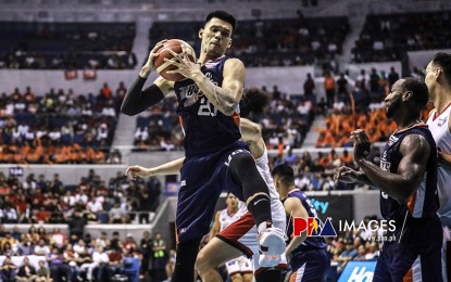 <p><strong>TO PLAY OR NOT TO PLAY.</strong> Meralco center Raymond Almazan grabs the ball in one of their games. Coach Norman Black said it would be Almazan's call if he is going to play or not on Friday night (Jan. 17, 2020) due to his leg injury. <em>(Photo courtesy of PBA)</em></p>