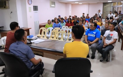 <p><strong>WASTE MANAGEMENT.</strong> Municipal Environment and Natural Resources Office (MENRO) chief Henry Jacob, (in blue shirt) presides over a waste management meeting with 54 barangay captains of Daraga, Albay on Friday, Jan. 17, 2020. He told the local officials to strictly abide by the Ecological Solid Waste Management Act, particularly the waste segregation policy. <em>(Photo courtesy of the Office of the Mayor, Daraga)</em></p>