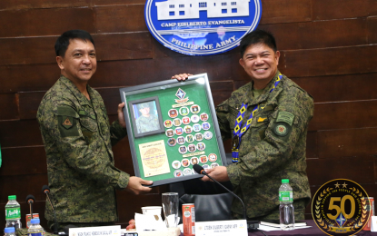 <p><strong>GUEST OF HONOR</strong>. Maj. Gen. Franco Nemesio Gacal (left) presents a plaque to Lt. Gen. Gilbert Gapay, new commanding general of the Philippine Army, during the Army’s 4th Infantry Division celebration of its 50th anniversary in Cagayan de Oro City on Friday (Jan. 17, 2020). Gacal expressed hope that Gabay’s leadership will steer the Army to greater heights of service. <em>(Photo courtesy of 4ID)</em></p>