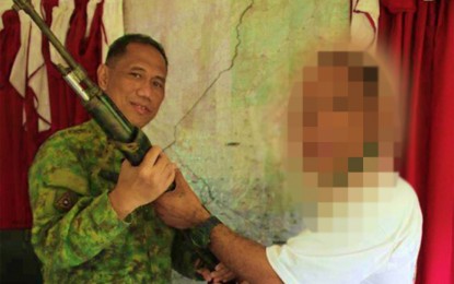 <p><strong>LOST CAUSE.</strong> Lt. Col. Neil Roldan, commander of the Army’s 7th Infantry Battalion, receives an M14 rifle from “Ka Raffy” (right), a member of the communist New People’s Army (NPA), who surrendered in Matalam, North Cotabato on Sunday (Jan. 19, 2020). The surrenderer said he decided to yield after realizing that the NPA is fighting a futile cause. (<em>Photo courtesy of 7IB</em>) </p>