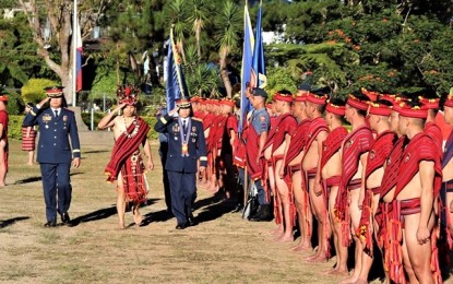 <p><strong>PARADE AND REVIEW.</strong> Brig. Gen. Tomas Apolinario troops the line as he is received by Police Regional Office Cordillera personnel wearing the native attire for the 26th Philippine National Police celebration of the Ethics Day at Camp Bado Dangwa on Monday. Apolinario spelled out the importance of doing good deeds as part of the image-building effort of the police. <em>(PNA photo by Liza T. Agoot)</em></p>